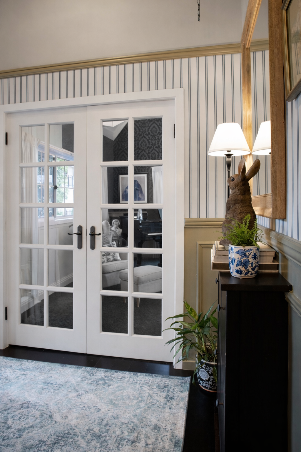 Classic 8-lite internal French doors in white timber in a bright living room.